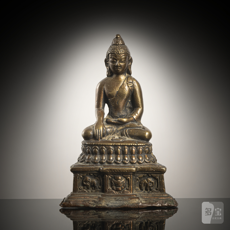 A BRONZE FIGURE OF AKSHOBHYA